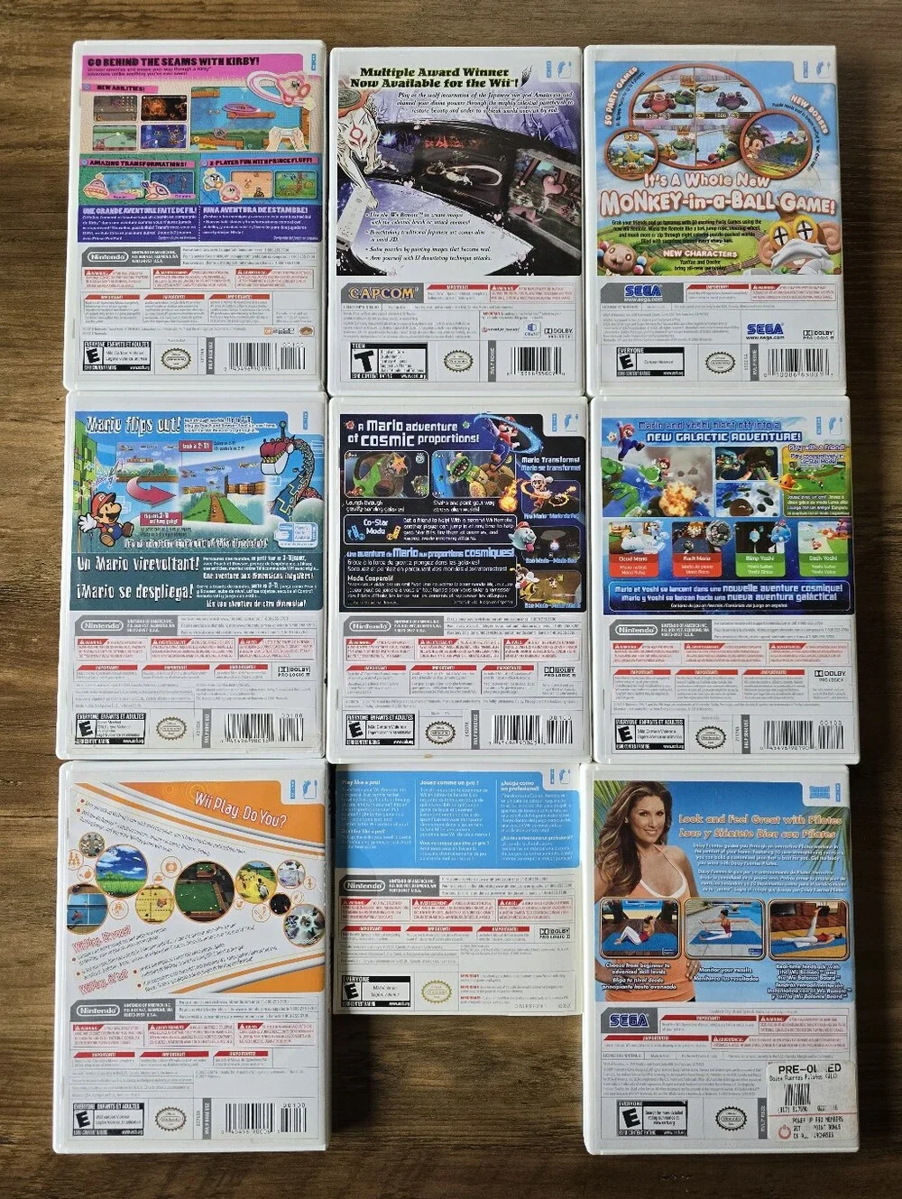 Lot of Nintendo Wii Console + 2 Remotes Nunchucks Tennis Rackets + 9 Video Games